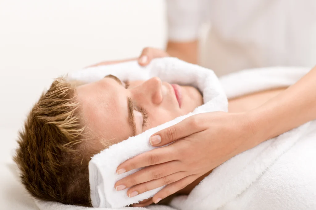 Man receiving professional acne facial treatment for smoother skin.