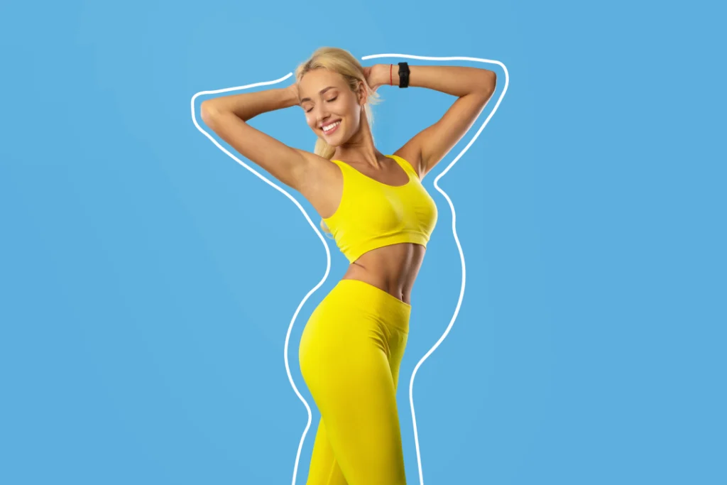 A fit woman in yellow workout attire representing the benefits of Emsculpt for a healthy physique.